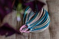 Colored braids made of pink and blue artificial hair