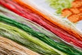 Colored bright threads for embroidery on a embroidered canvas. Royalty Free Stock Photo