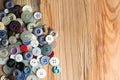 Colored buttons on wooden board, Colorful buttons, on old wooden Royalty Free Stock Photo