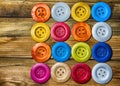 Colored buttons on wooden board, Colorful buttons, on old wooden Royalty Free Stock Photo