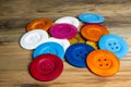 Colored buttons on wooden board, Colorful buttons, on old wooden Royalty Free Stock Photo