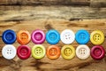 Colored buttons on wooden board, Colorful buttons, on old wooden Royalty Free Stock Photo