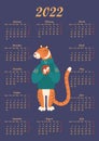 Colored calendar for 2022 with a cute smiling tiger in a sweater and a cup of hot drink