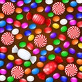 Colored candies, sweets and lollipops. On a brown wooden background. View from above.