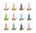 Colored candles in gold candlesticks Royalty Free Stock Photo