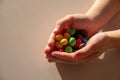 Colored candys, sugar, much, non healtly in the hands of a child