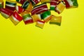 Colored caramel sweets on yellow background. Desserts, sweets, food concept. Colorful food.