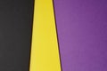 Colored carboards background in black yellow purple tone. Copy s