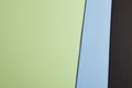 Colored carboards background in green, blue, black tone. Copy sp