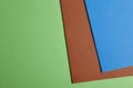 Colored carboards background in green, brown, blue tone. Copy sp