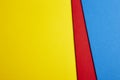 Colored carboards background in yellow, red, blue tone. Copy spa