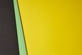 Colored cardboards background in black green yellow tone. Copy s