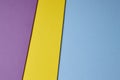 Colored cardboards background in blue yellow purple tone. Copy s