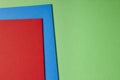 Colored cardboards background in green blue red tone. Copy space