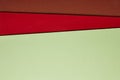 Colored cardboards background in green red brown tone. Copy spac