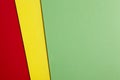 Colored cardboards background in green yellow red tone. Copy spa