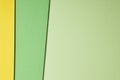 Colored cardboards background in green yellow tone. Copy space