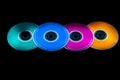 Colored cdrom on black background Royalty Free Stock Photo