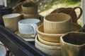 colored ceramic mugs on a wooden shelf Royalty Free Stock Photo