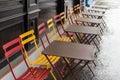 Colored chairs and tables on street near coffee shop Royalty Free Stock Photo