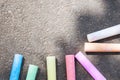 Colored chalk on asphalt. Children`s creativity games. Background with place for text, frame, copy space. Back to schoo Royalty Free Stock Photo