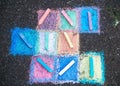 Colored chalk on a sidewalk background, top view Royalty Free Stock Photo