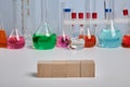 Colored Chemical Flasks and Wooden Cubes - Photo with Copyspace
