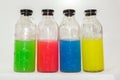 Colored chemicals, glass bottles on a white background