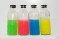 Colored chemicals, glass bottles on a white background