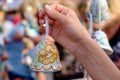 Colored clay bell in women's hand Royalty Free Stock Photo