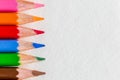 Colored close up pencils on white background. Royalty Free Stock Photo