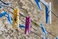 Colored clothespins hanging on a rope Royalty Free Stock Photo