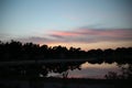 Colored clouds by sunset are reflecting on a lake on landgoed Royalty Free Stock Photo