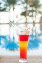 Colored cocktails on a background of water. Royalty Free Stock Photo