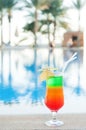 Colored cocktails on a background of water. Royalty Free Stock Photo
