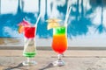 Colored cocktails on a background of water Royalty Free Stock Photo