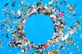 Colored confetti flying on blue background Royalty Free Stock Photo