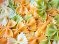 Colored cooked farfalle pasts closeup