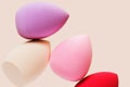 Colored cosmetic beauty blender sponges Red and pink colored sponges different shape.