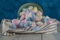 colored cotton balls on a blue background Royalty Free Stock Photo