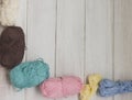 Colored cotton yarn on white wooden background. Copy space Royalty Free Stock Photo