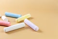 Colored crayons on a beige background. Child Game. Hobby. Child development and leisure concept. Copy space. Royalty Free Stock Photo