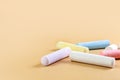 Colored crayons on a beige background. Child Game. Hobby. Child development and leisure concept. Copy space. Royalty Free Stock Photo