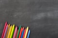 colored crayons on the blackboard Royalty Free Stock Photo