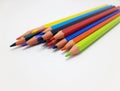 Colored crayons on white background