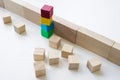 Colored cubes overcome an obstacle as a concept of teamwork, collaboration and unity. Royalty Free Stock Photo