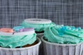 Colored cupcakes close-up on grey fabric background Royalty Free Stock Photo