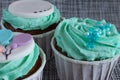 Colored cupcakes close-up on grey fabric background Royalty Free Stock Photo