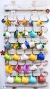 Ceramic colored cups on hooks Royalty Free Stock Photo