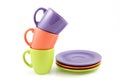 Colored cups with plates Royalty Free Stock Photo